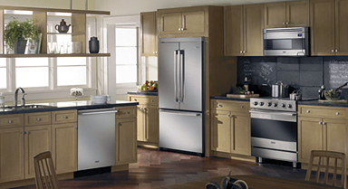 a kitchen with a full range of appliances